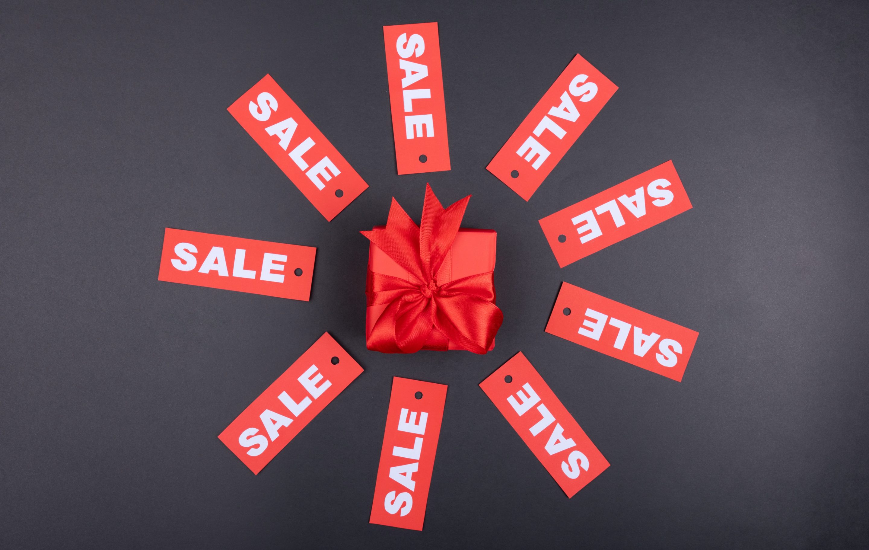 How to ask for the sale without feeling sleazy Two people working and pointing at a laptop screen